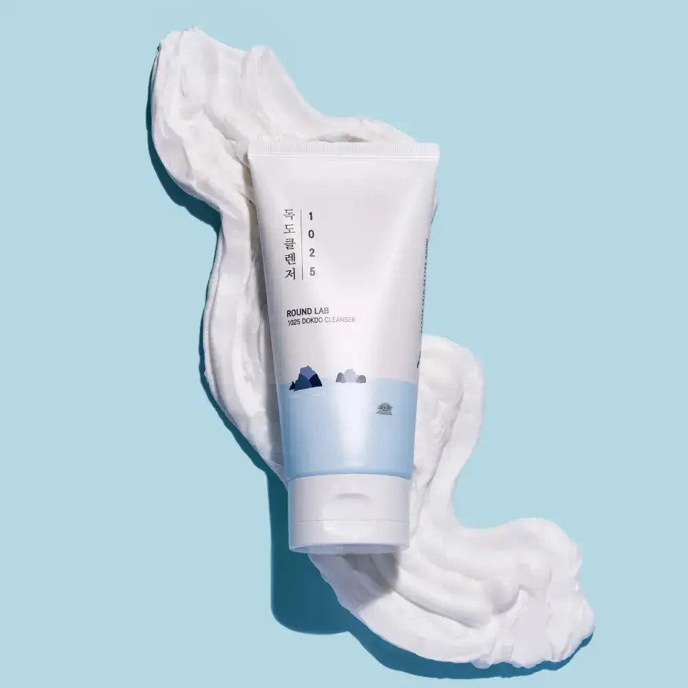 ROUND LAB 1025 Dokdo Cleanser tube on white foam against a blue background — manufacturer photograph