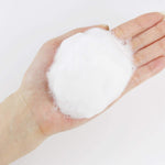 ROUND LAB 1025 Dokdo Cleanser foam held in wet hands — manufacturer texture photograph