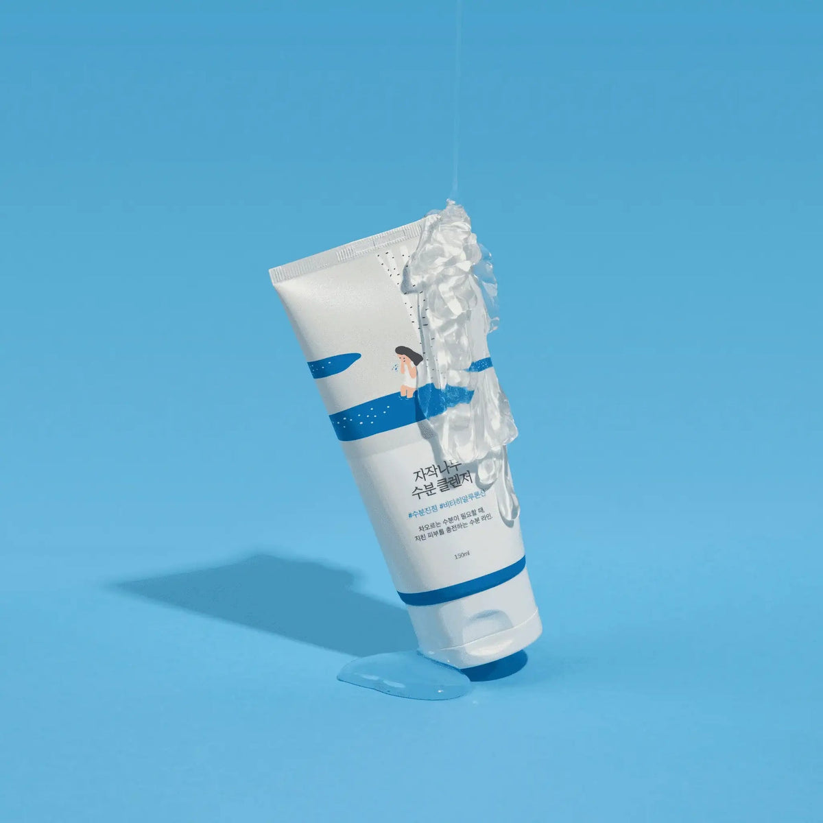 ROUND LAB Birch Juice Moisturizing Cleanser 150 ml tube with clear gel against a blue background — manufacturer photograph
