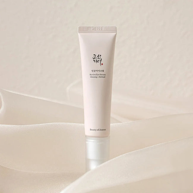 Beauty of Joseon Revive Eye Serum Ginseng + Retinal 30ml tube on softly folded ivory fabric