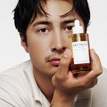 Model holding SKIN1004 Madagascar Centella Ampoule 100 ml — manufacturer photograph